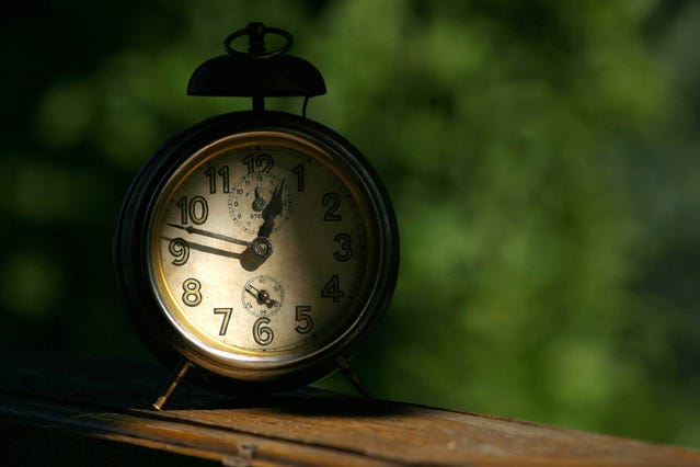 Image of an old-fashioned clock in shadows
