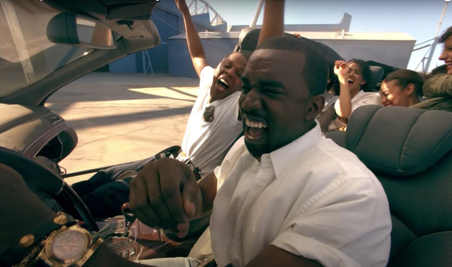 Kanye wearing a yellow gold Daytona in “Otis”