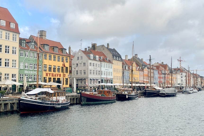 A close up of colourful buildings along the river in Copenhagen