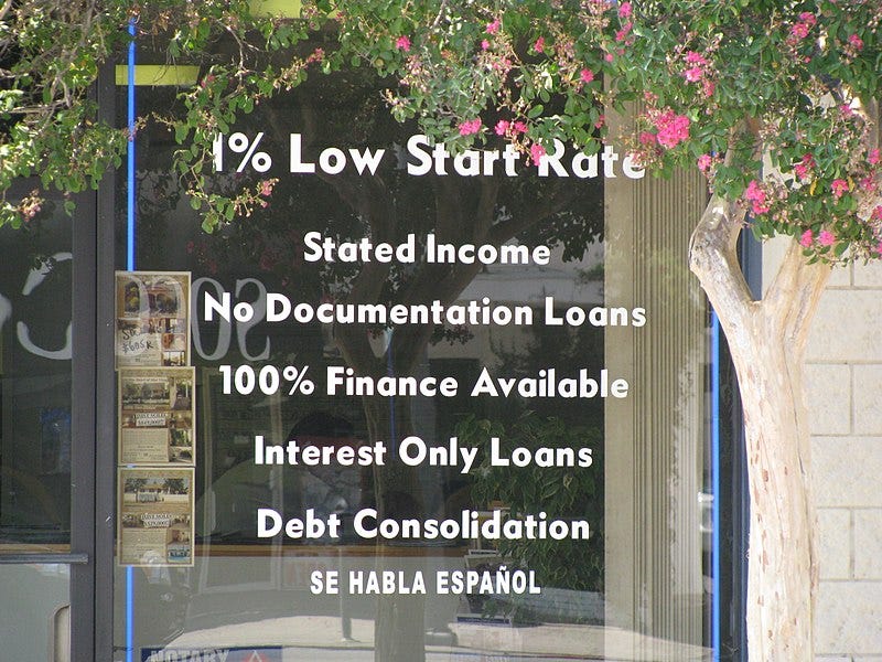 From 2008: A window with advertisements for financial services. "No documentation loans," "debt consolidation," etc. 