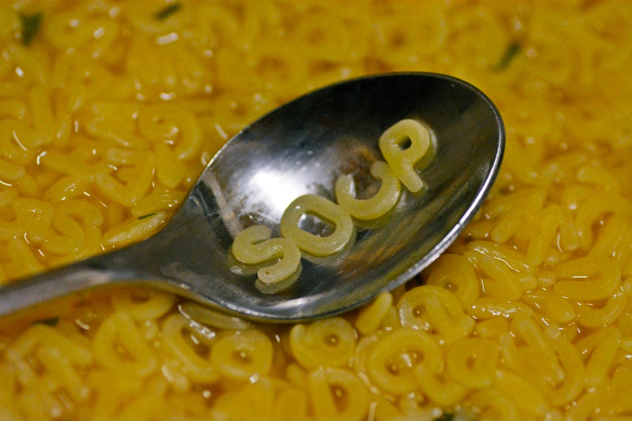 Soup spelled out in soup letters on spoon