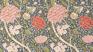 V&A · William Morris - a floral design on navy background. The flowers are pink and red
