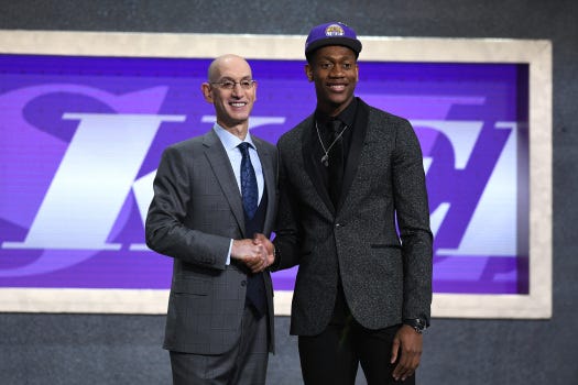 De’Andre Hunter poses with NBA Commissioner Adam Silver after being drafted with the fourth overall pick by the  Lakers during the 2019 NBA Draft at the Barclays Center on June 20, 2019 in the Brooklyn borough of New York City. (Photo by Sarah Stier/Getty Images)
