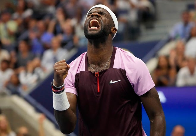 Frances Tiafoe celebrates after breaking Rafael Nadal's serve during their Round of 16 match at the U.S. Open.