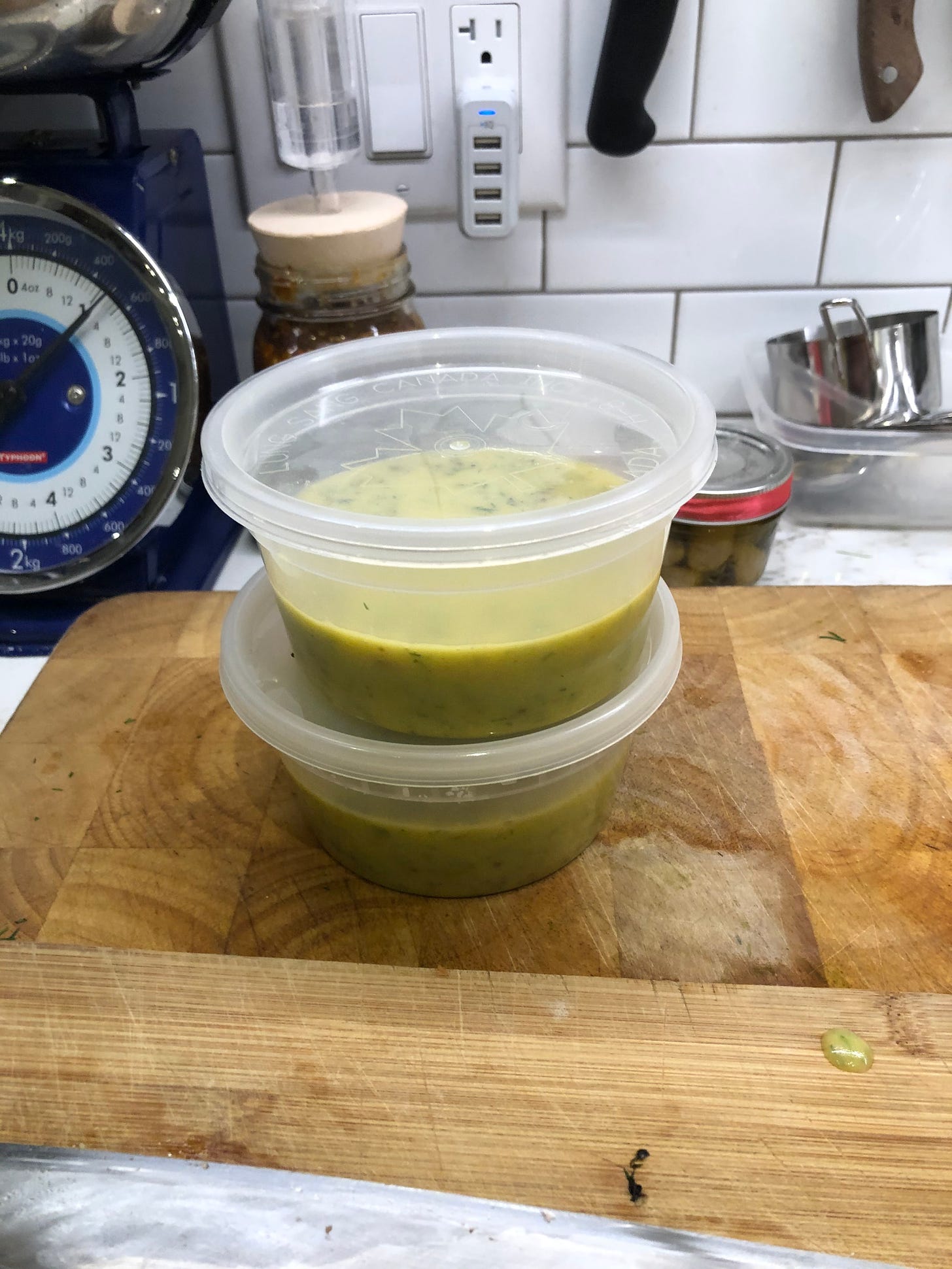 Two containers of mustard-dill sauce