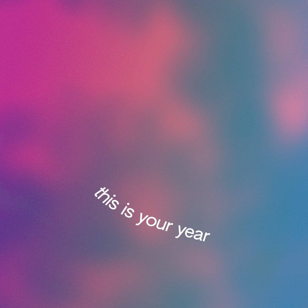 The text 'this is your year' on a gradient background. The text is warped and floats as a bird against a sky.