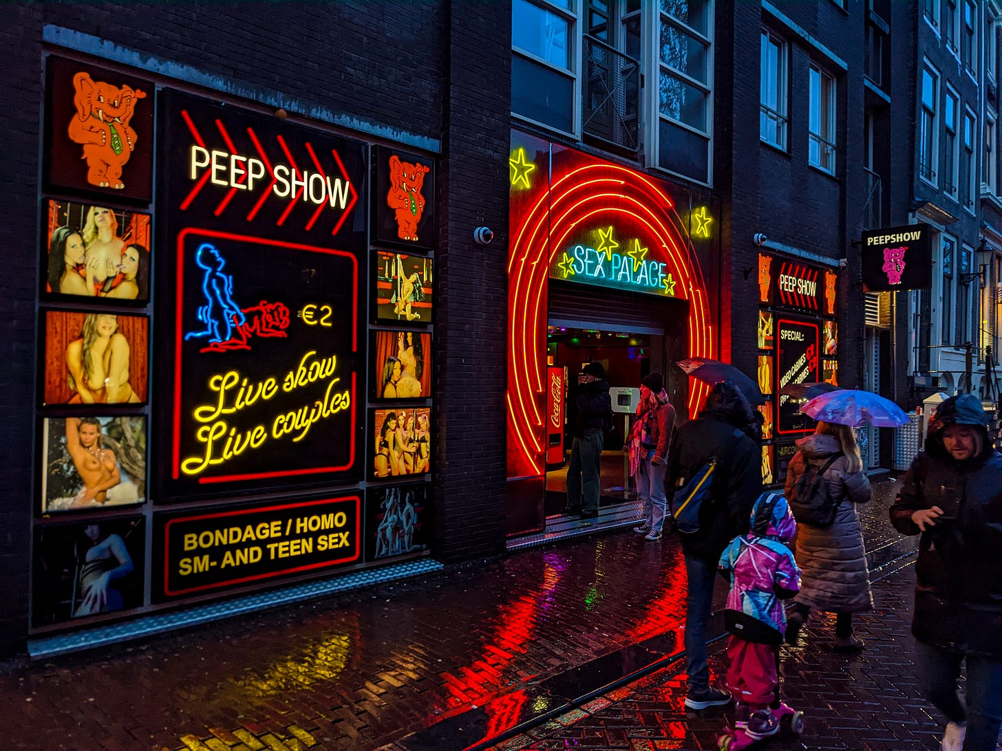 One of Amsterdam's sex clubs called the Sex Palace with lots of red neon and risque photos of women. 