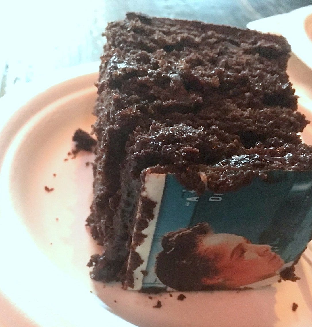 chocolate layer cake square with book cover image of Flemmie Kittrell on top