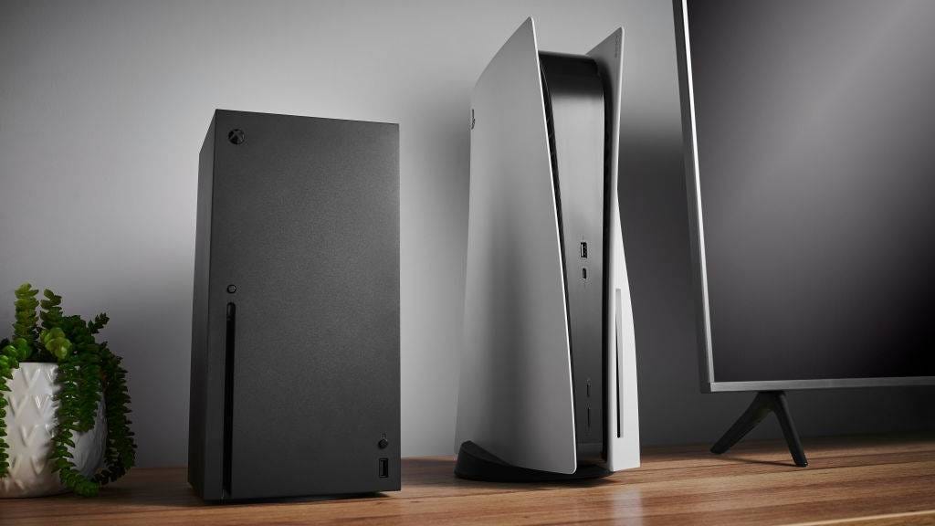 Xbox Series X and PS5 stood side by side on a wooden table