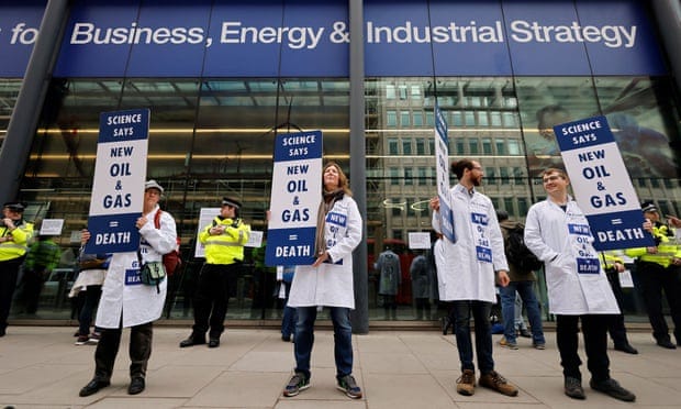 Scientists for Extinction Rebellion demonstrate outside the Department for Business, Energy and Industrial Strategy in London. 