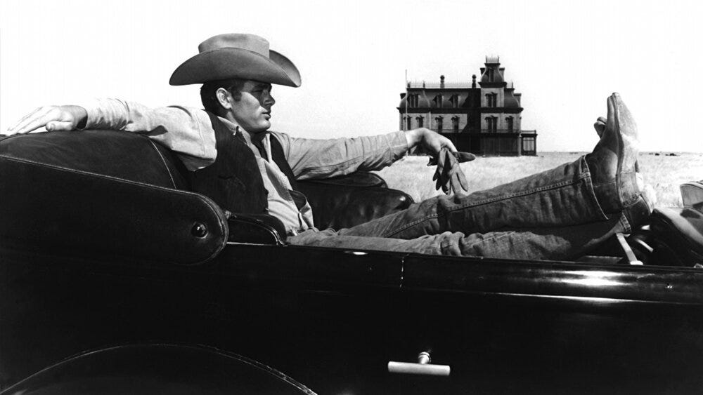 James Dean as Jett Rink in front of the facade of the Reata mansion in Giant.