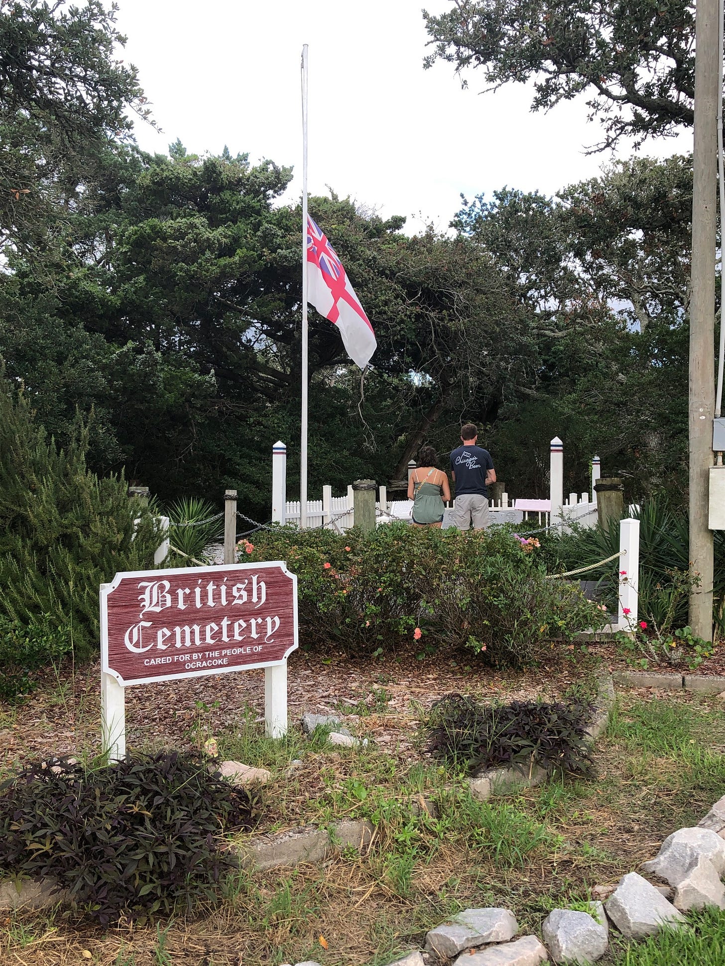 british flag over cemetery at half staff