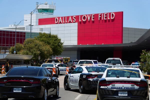 The police were out in force outside Dallas Love Field Airport on Monday after a woman opened fire inside and was shot by a police officer.