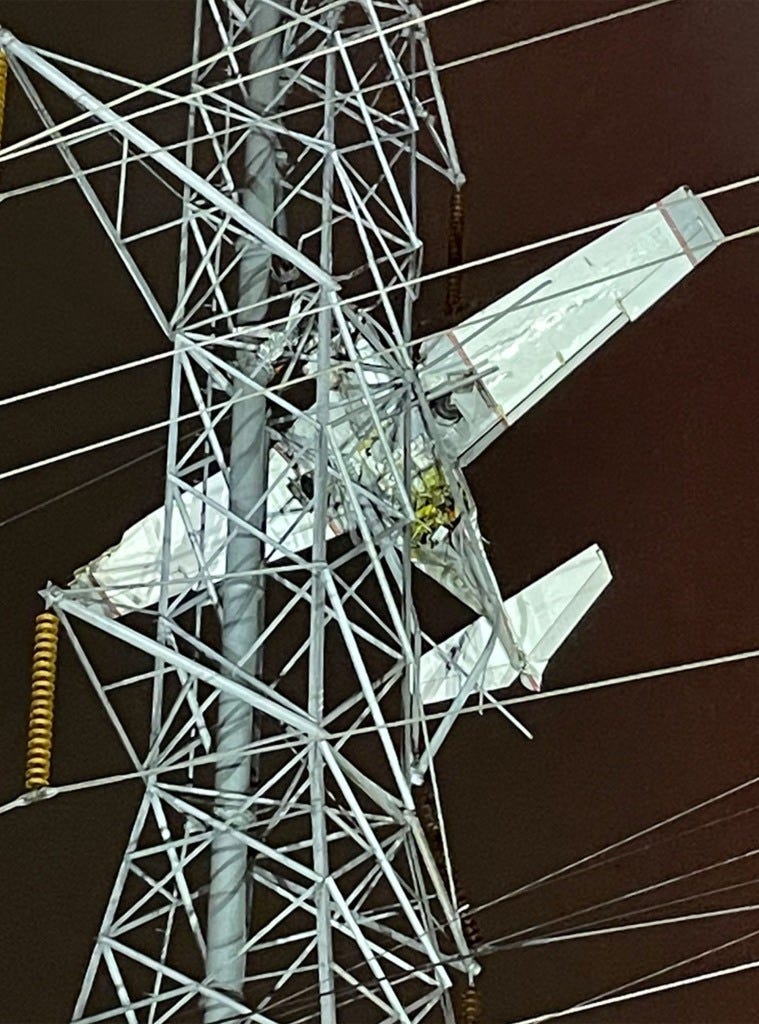Plane crashed into power lines 100 feet off ground in dark sky