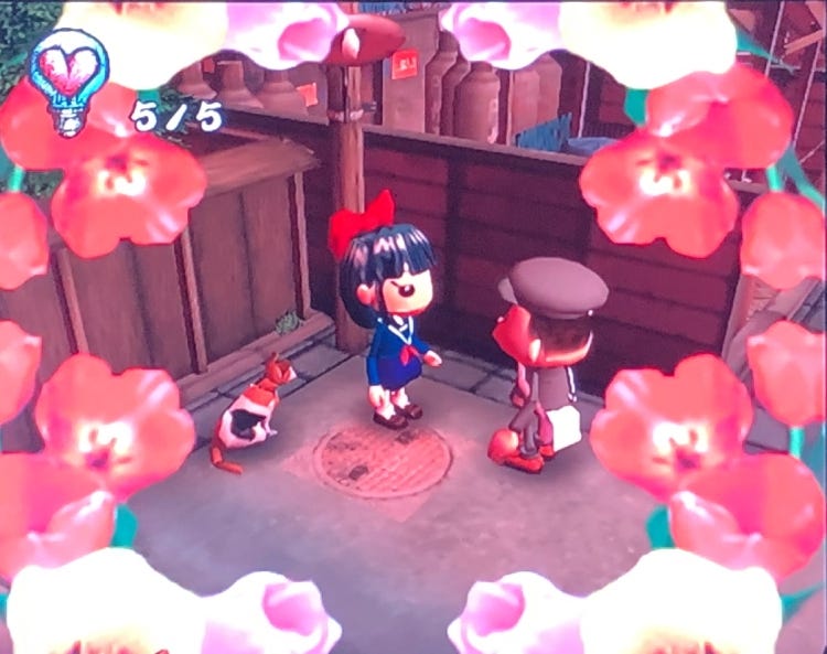A screenshot from Chulip showing a ring of tulips on screen as a frame to the meeting of the young boy and young girl.