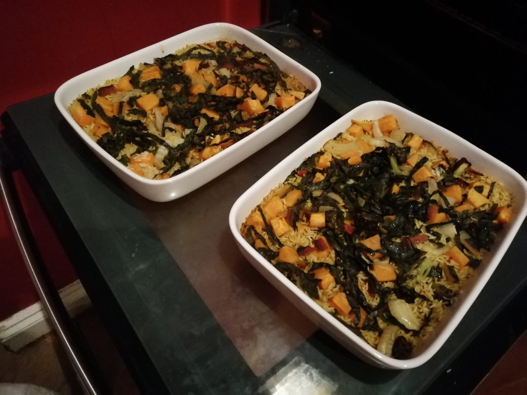 Photograph: two large casserole dishes full of vegetable biryani