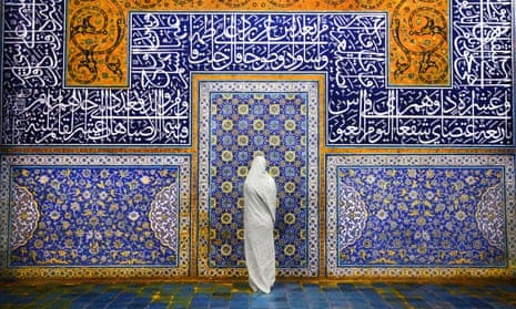 a veiled woman at the Sheikh Lotfollah Mosque, Isfahan.