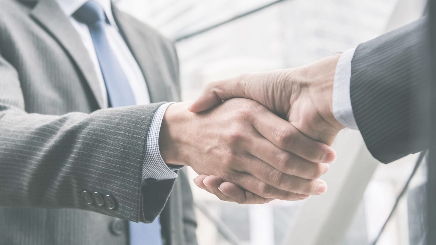 two people doing a handshake