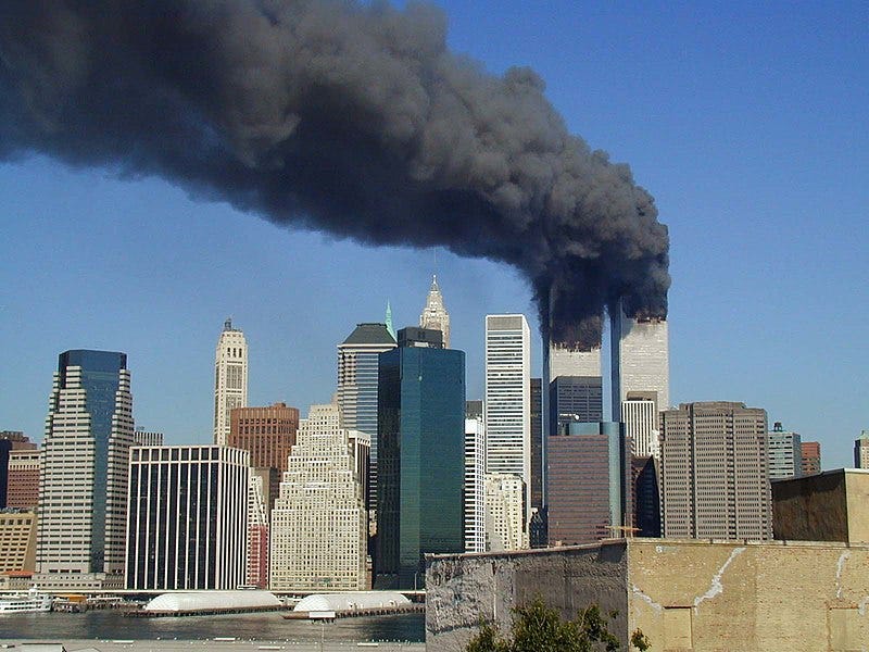 Black smoke billowing over Manhattan from the Twin Towers