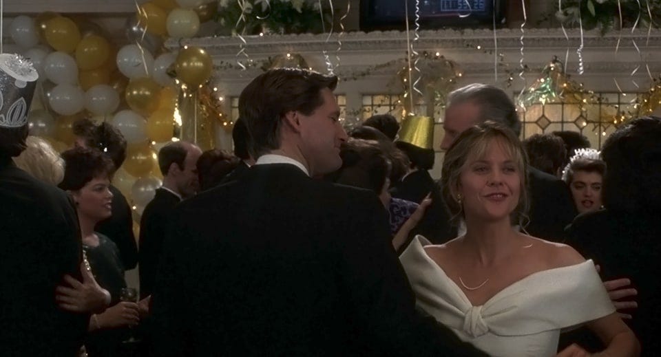 Screen grab of Bill Pullman and Meg Ryan dancing at a swanky New Year's Eve Party in Sleepless in Seattle