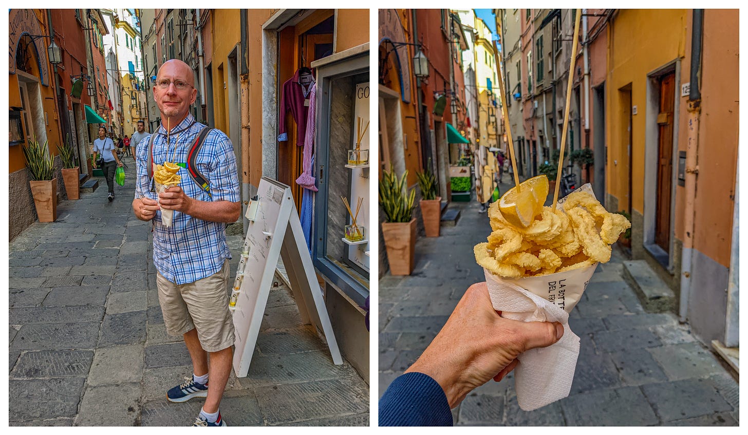Brent holding a cone of fried squid, and a close up of Michael holding the cone up for a picture with the street in the background. 