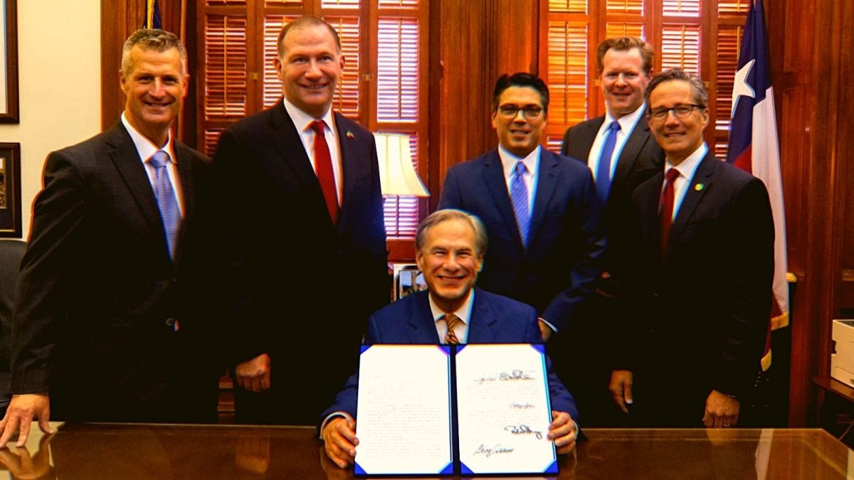 Texas Gov. Greg Abbott and other legislators "signing laws to reform ERCOT and weatherize and improve the reliability of Texas’ power grid."