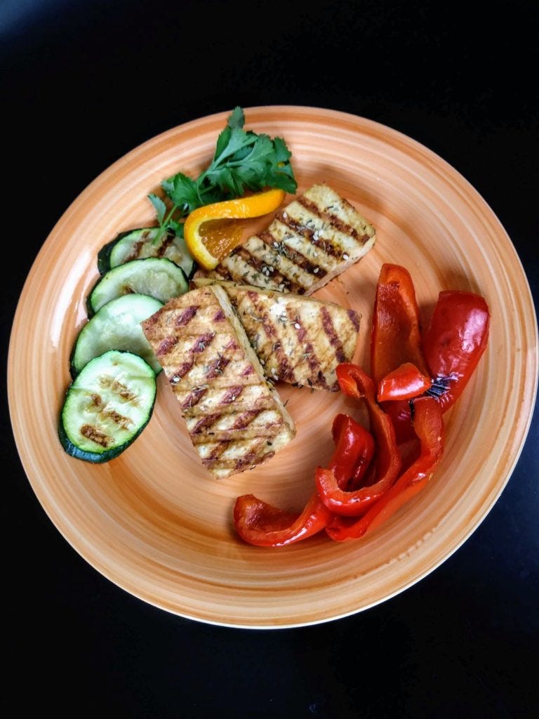 Orange Tahini Grilled Tofu with grilled red peppers and zucchini