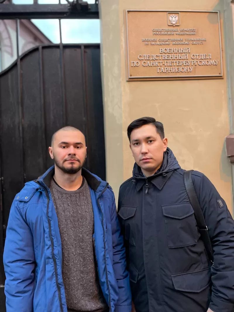 Kirill Berezin (left) and his lawyer Nikifor Ivanov, pictured at the Investigative Committee building, before Kirill turned himself in. © Marina Tsyganova