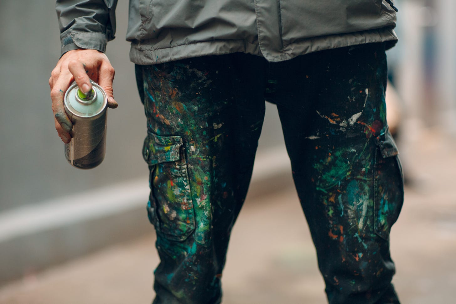 Spray Can Artist with paint splattered pants