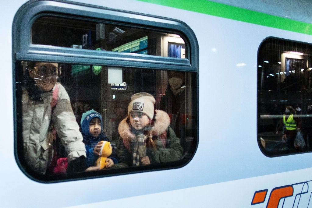 People fleeing war-torn Ukraine arrive on a train from Poland to Berlin on Sunday. (Carsten Koall / Getty Images)