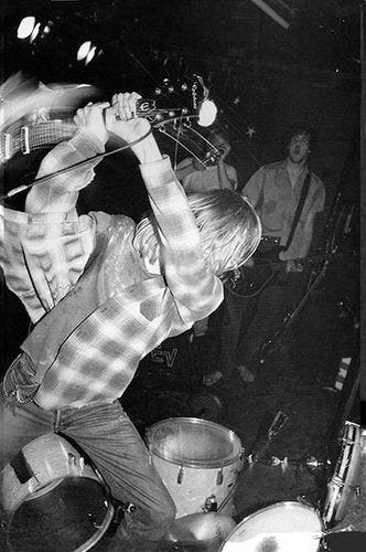 Image result for kurt cobain smashing guitar