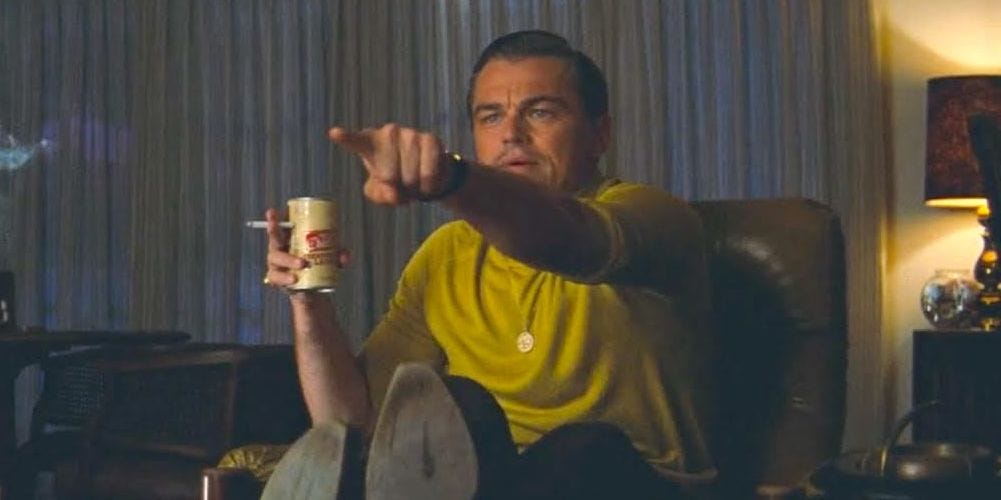The meme of DiCaprio pointing at something on televison with a beer and cigarette in his hand. 