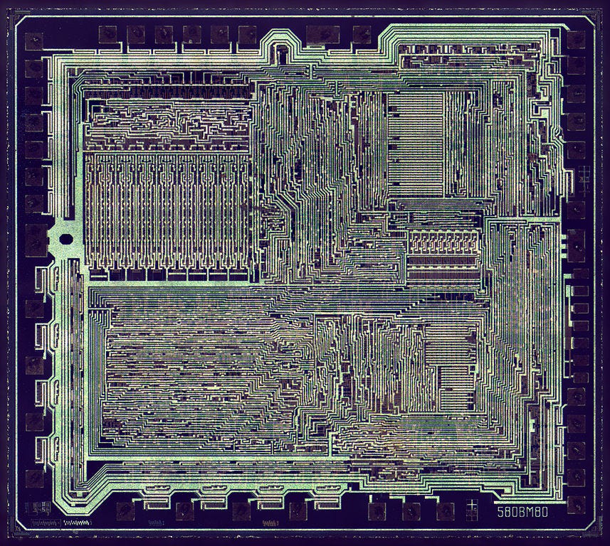 The KR580VM80A is an Intel 8080-compatible Soviet processor which was in manufacturing until mid 90's. Die size 4634x4164µm, 5µm technology node. Dark field with metal clearly visible.