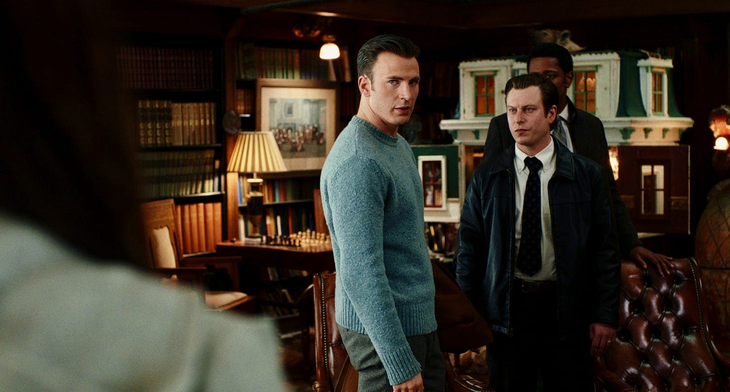 Chris Evans as Ransom Drysdale (left) and Noah Segan as Trooper Wagner (right) in KNIVES OUT.