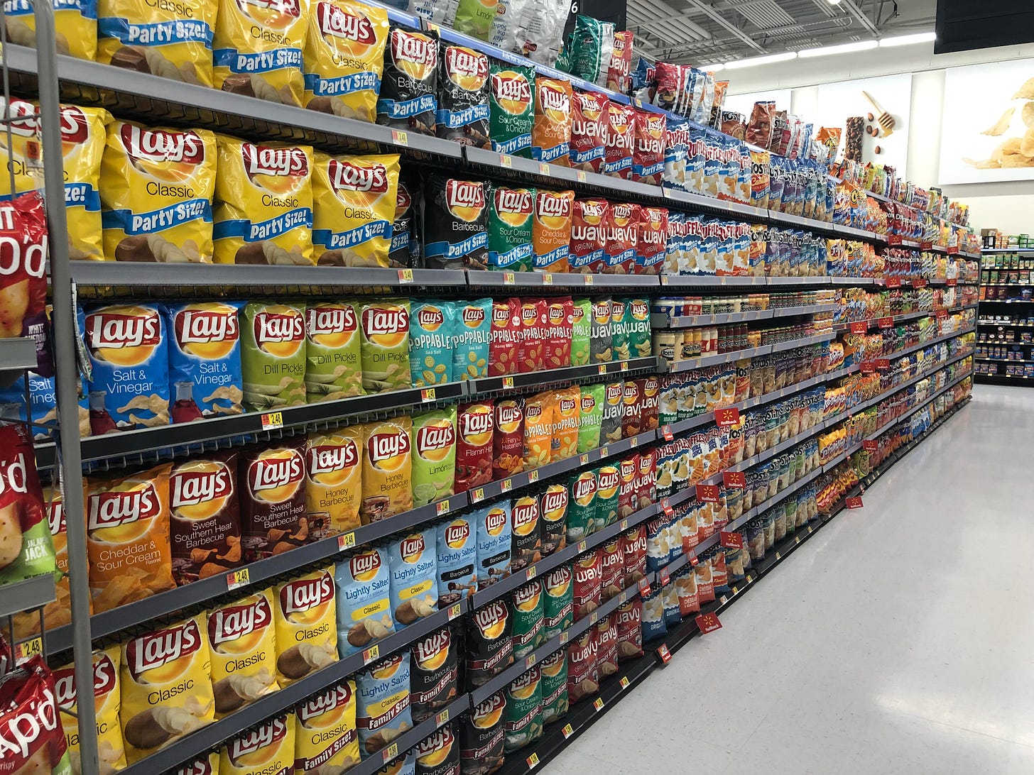This aisle of potato chips. This is the Walmart across the street from  Walmart HQ in NWA, also only a few miles from the first ever Walton Store.:  oddlysatisfying