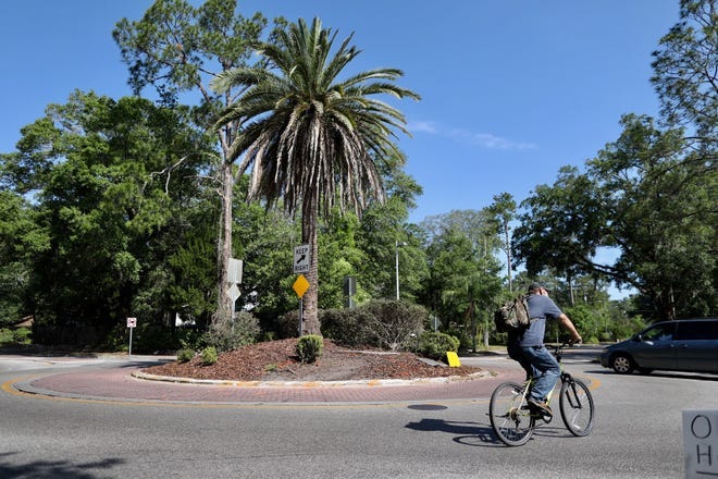The roundabout at Northeast Ninth Street and Northeast Eighth Avenue, where two people died in a traffic crash early Tuesday morning. [Rob C. Witzel/The Gainesville Sun]