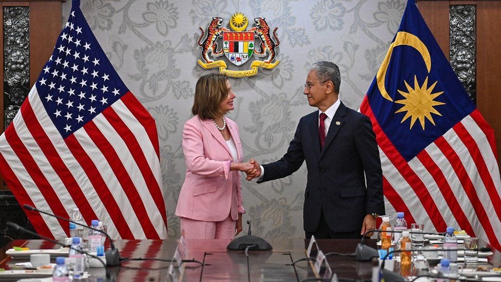 Pelosi (L) and Azhar Azizan Harun in Malaysia
