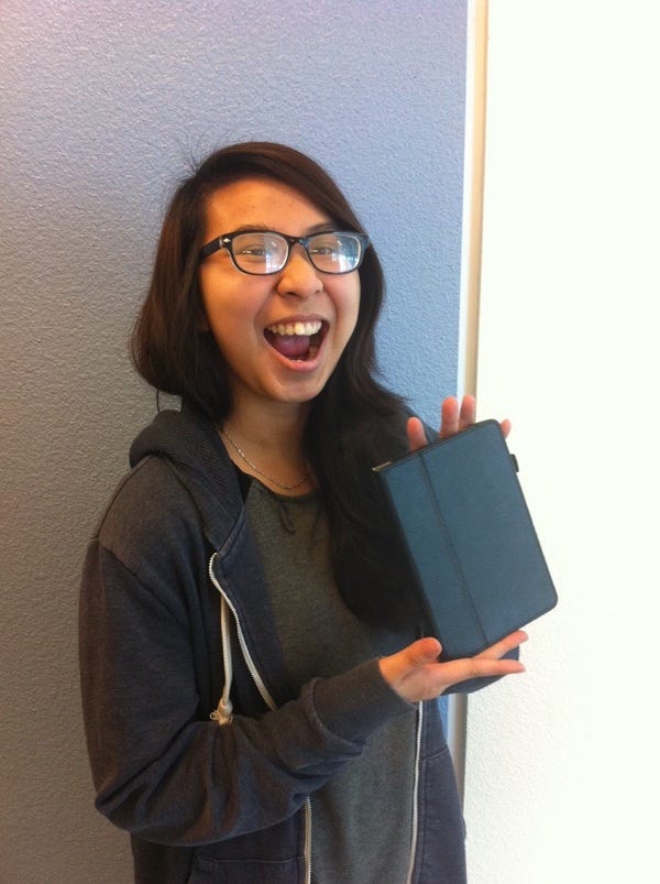 Oakland student Chi likes her Kindle. Donate $10 to paypal.me/kcp so she can request another book to read!