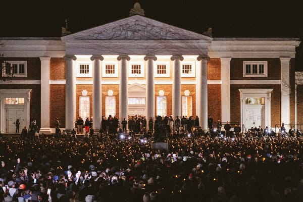 Students at the University of Virginia, many holding candles, gathered on Monday night for a vigil for three students who were fatally shot.