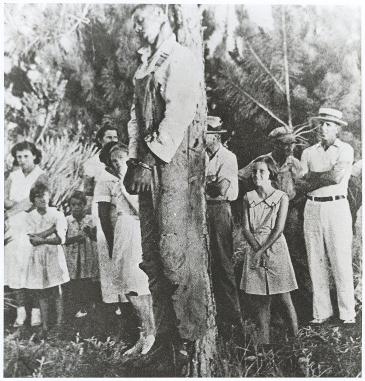 Rubin Stacey, lynched victim, hanging from a tree - NYPL Digital Collections