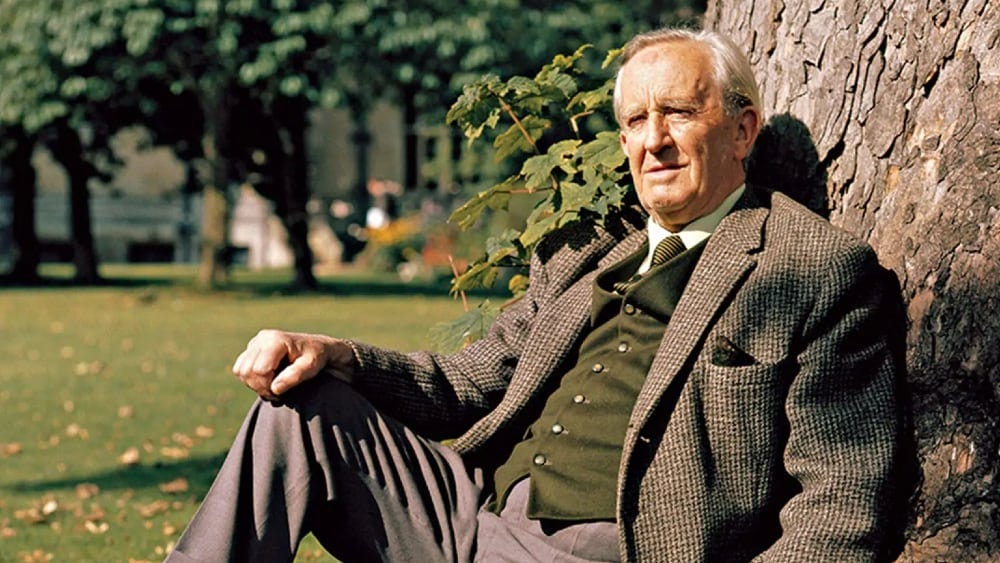 J.R.R. Tolkien sitting against a tree