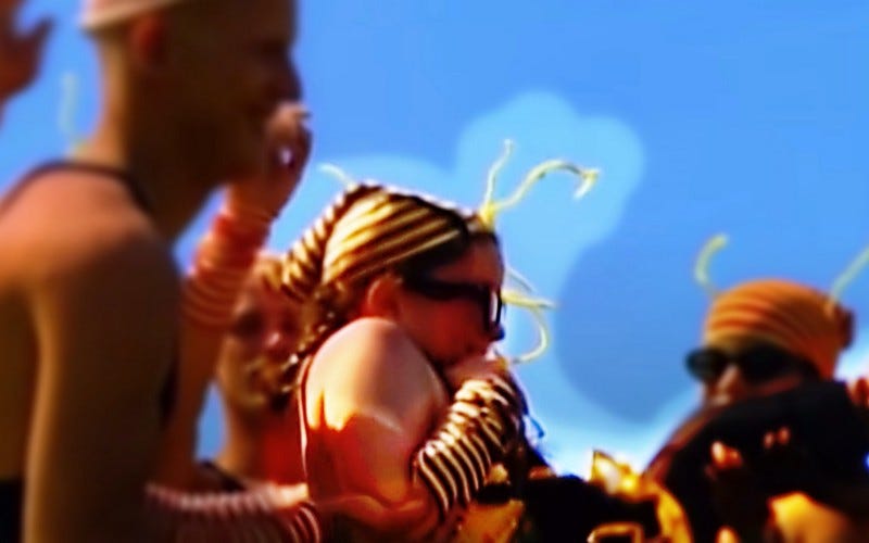 Girl in bee costume falls backwards into the arms of strangers.