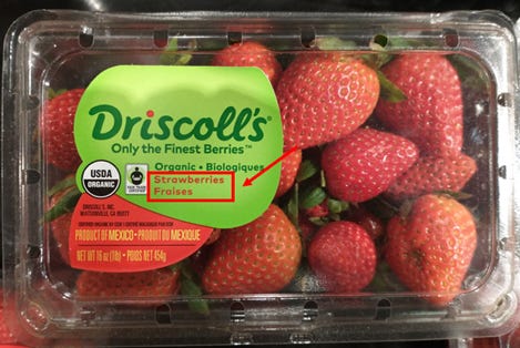 carton of strawberries, labeled in both english and french