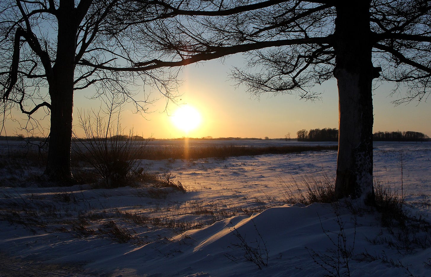 Sunset on a snowy day in Henry County, Indiana.