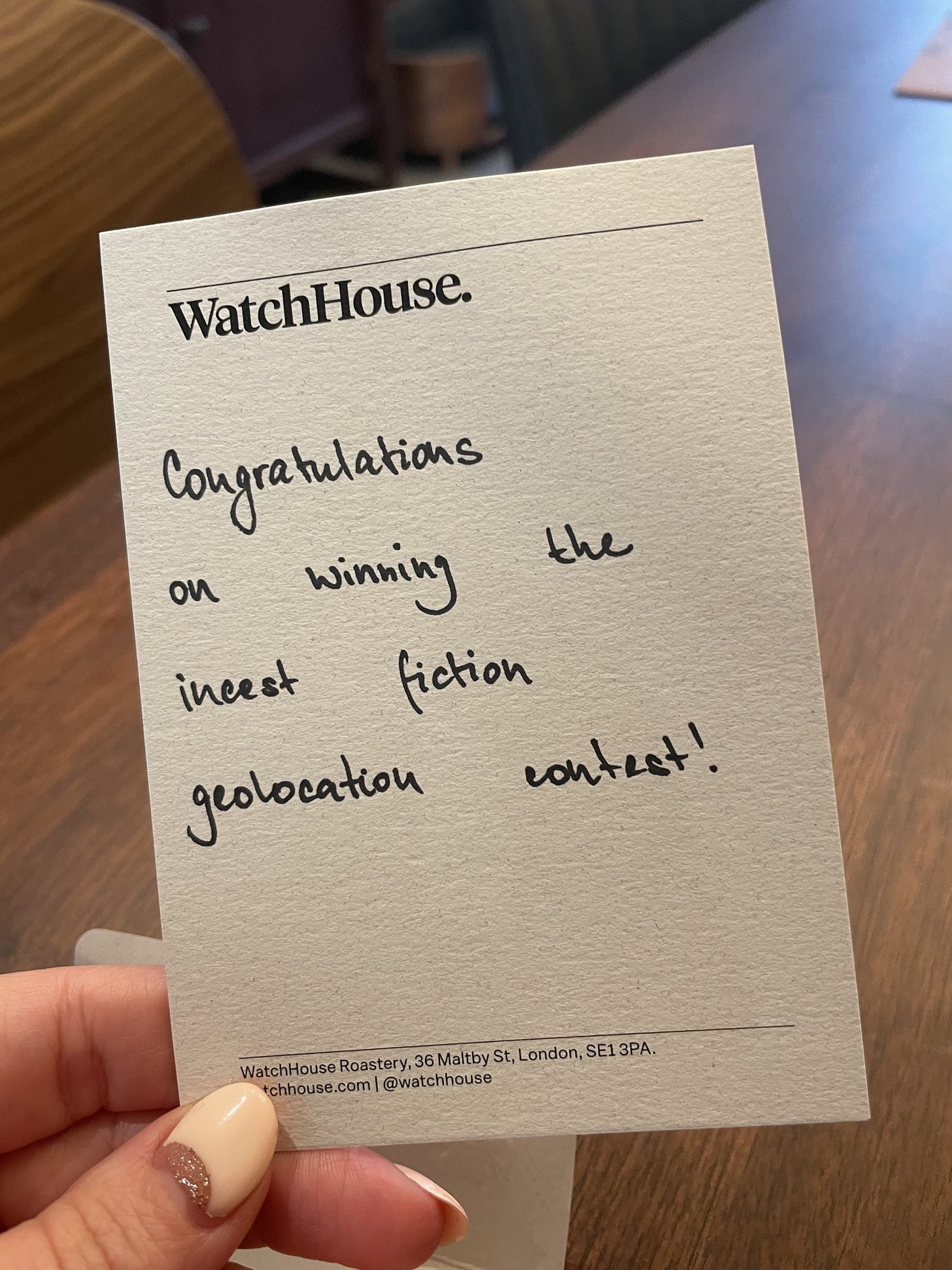 Handwritten note saying "Congratulations on winning the incest fiction geolocation contest!"