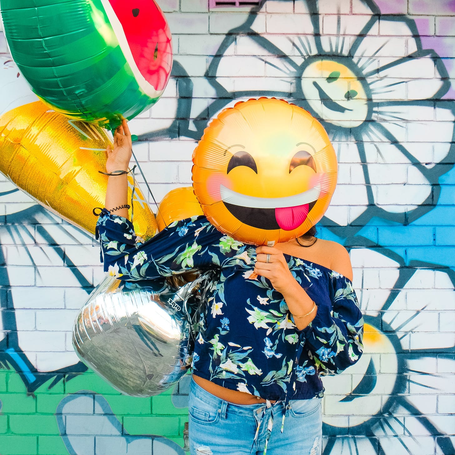 woman holding balloons photo