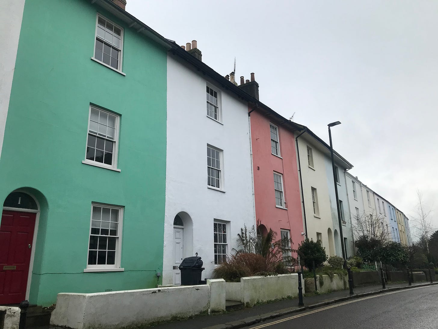 A row of pastel coloured houses in Totnes, Devon