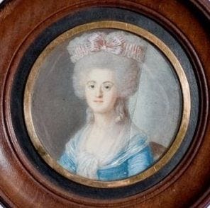 Portrait of a woman in 18th century wealth French dress: a blue bodice, gray wig piled high on her head. She has pale skin and looks to the left.
