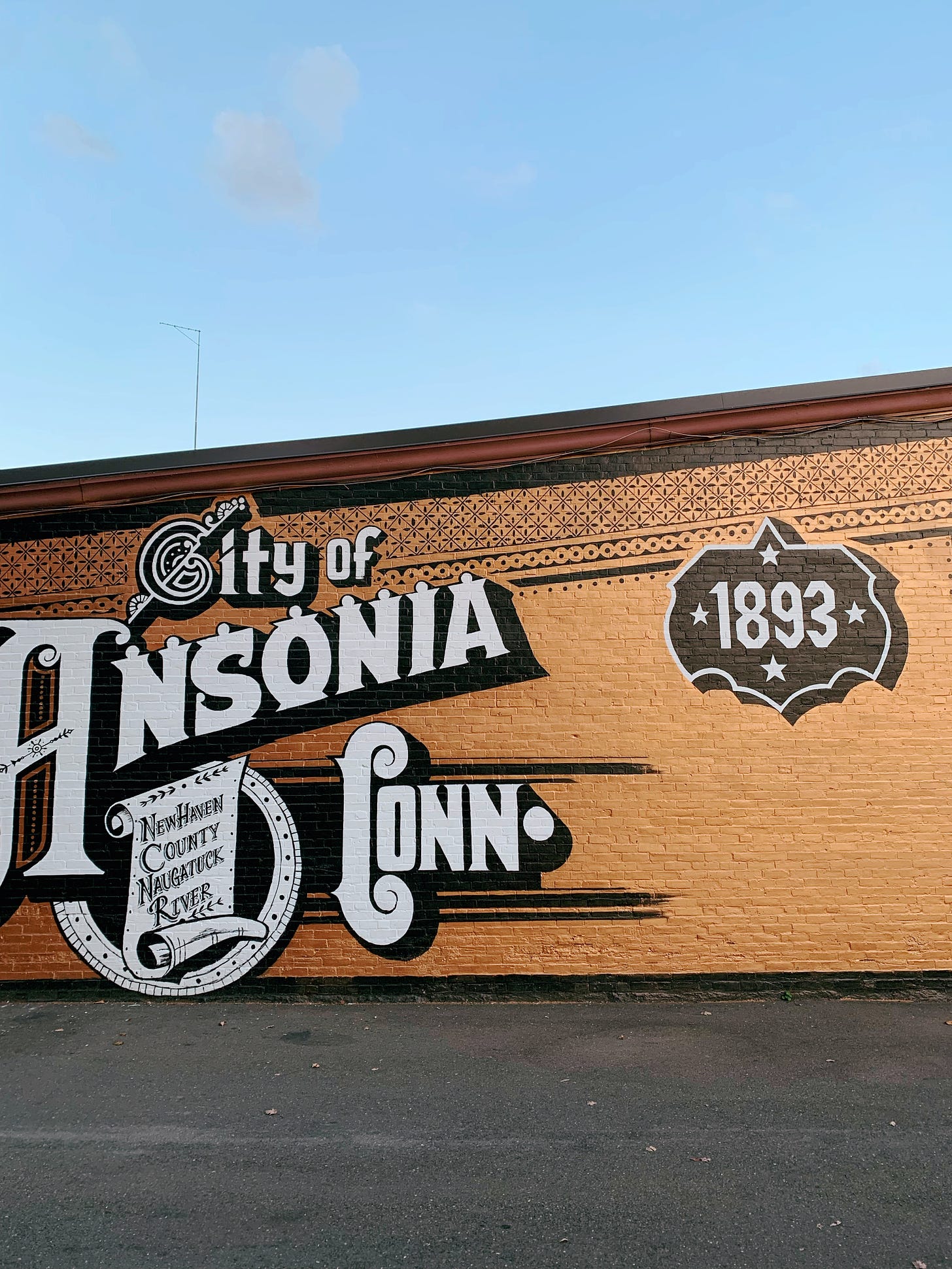 Painted mural saying "City of Ansonia 1893"