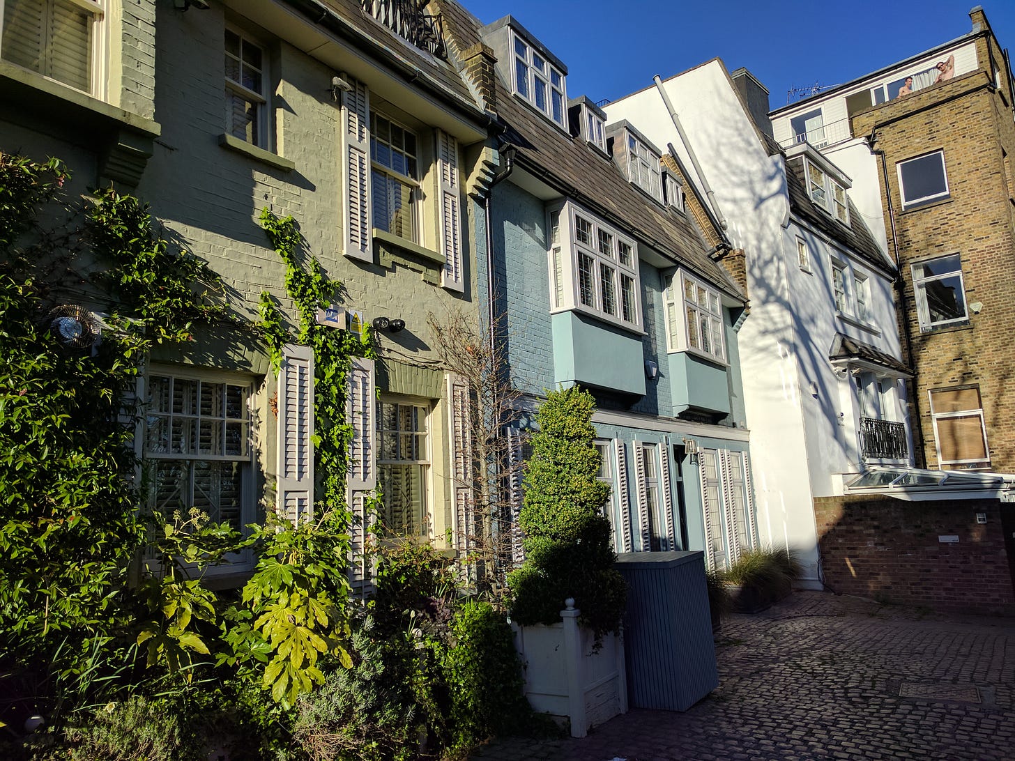 A photo of some pretty houses in a small court in Hampstead London neighbourhood